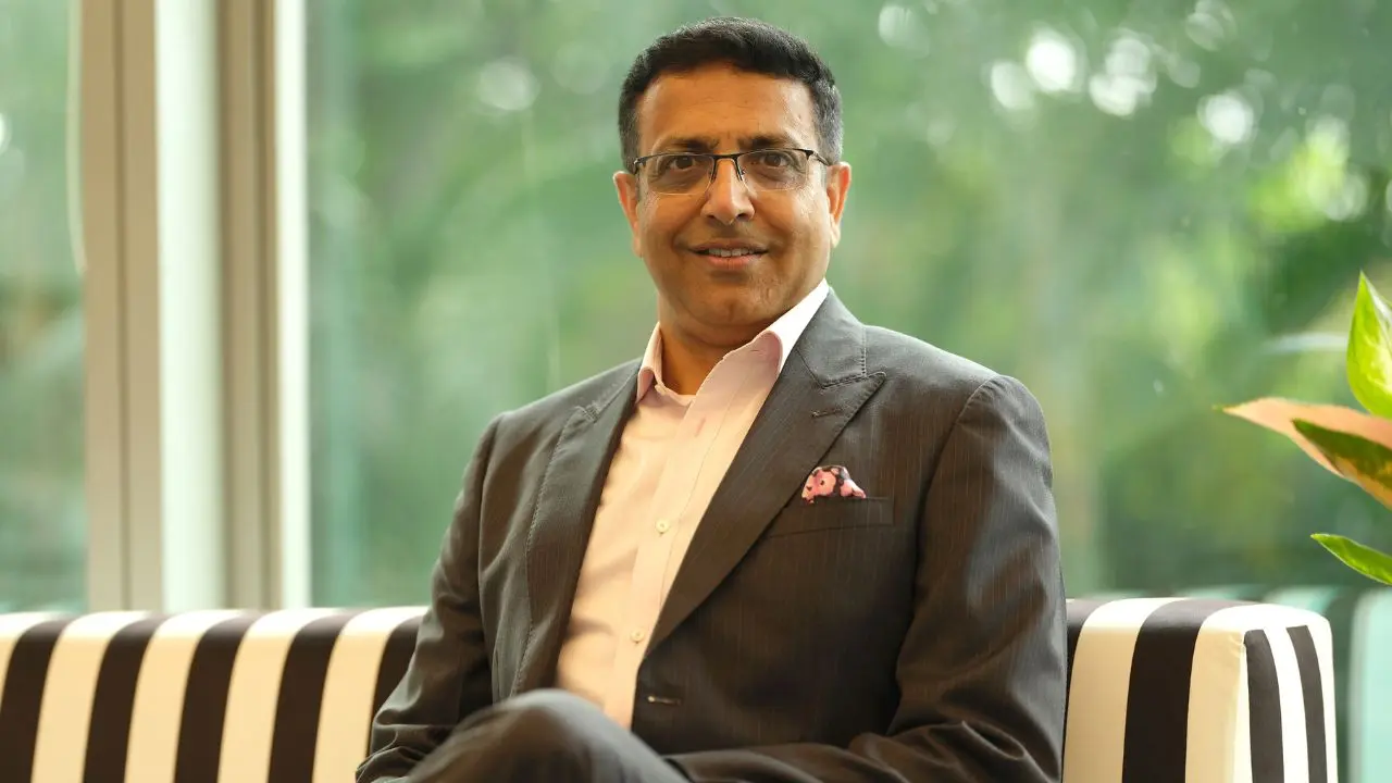 Sunil Kataria, newly appointed CEO and MD of Godrej Agrovet, poses in a formal suit during an official photoshoot.
